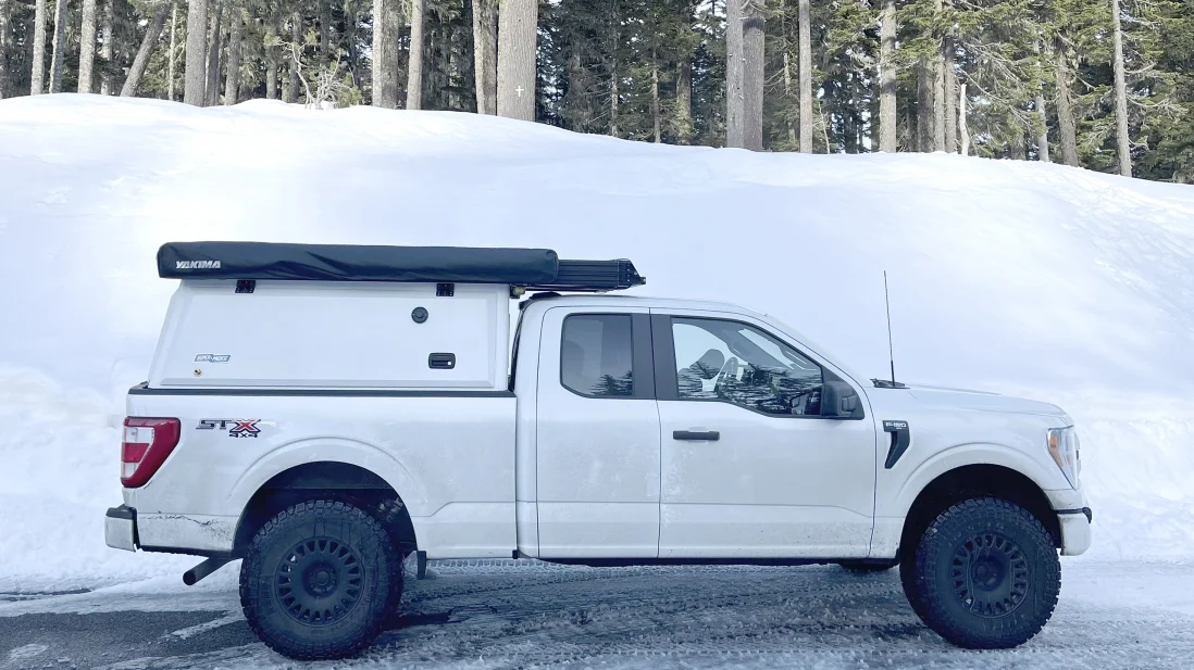 white truck with Super Pacific X1 truck camper